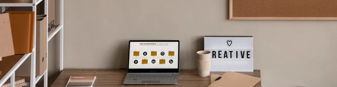 Modern office setup with laptop and creative elements